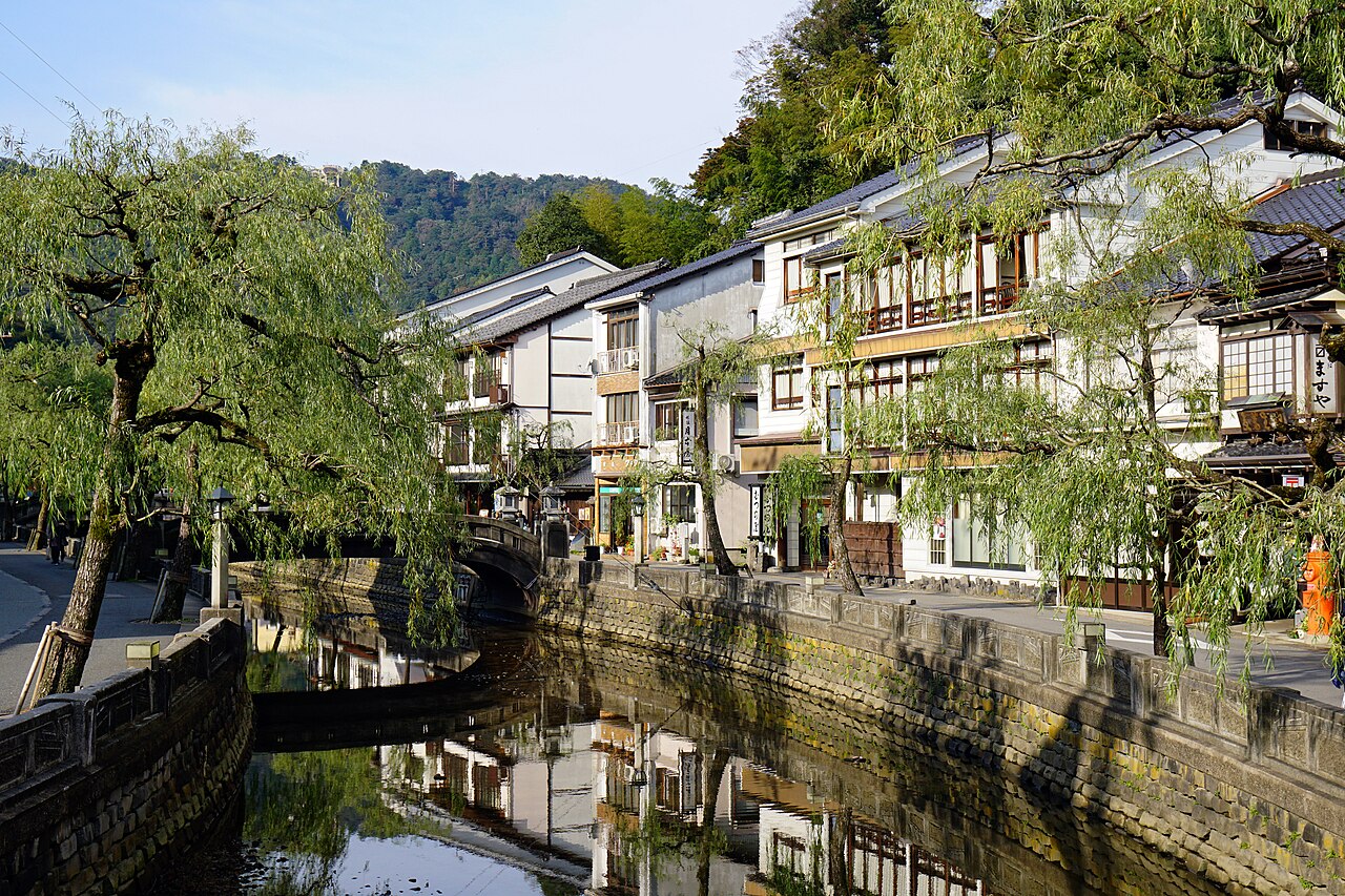Kinosaki Onsen - Willow-lined Otani River with stone bridges and wooden ryokan