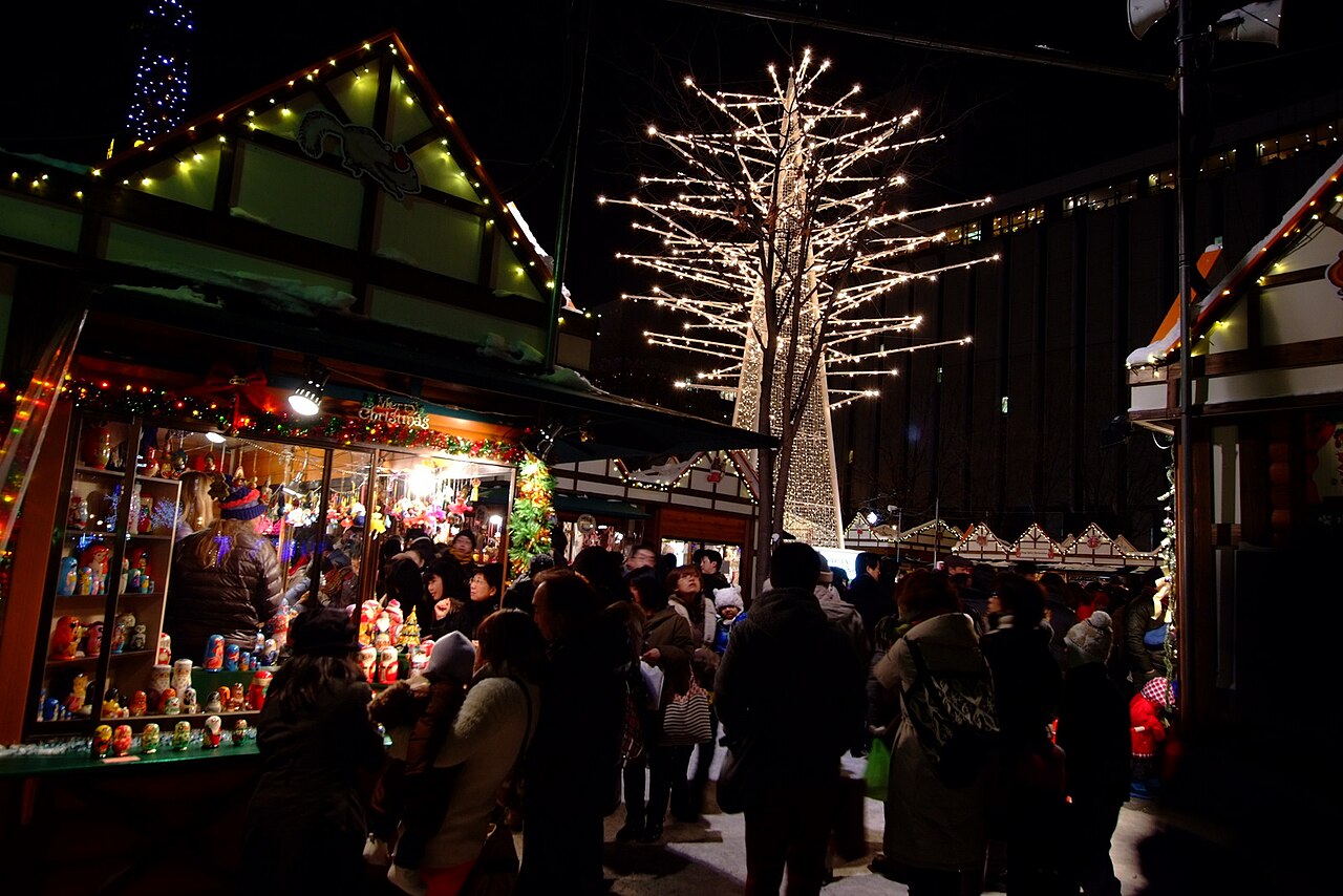Munich Christmas Market in Sapporo - Wooden stalls and a lit tree at Sapporo's Munich Christmas Market