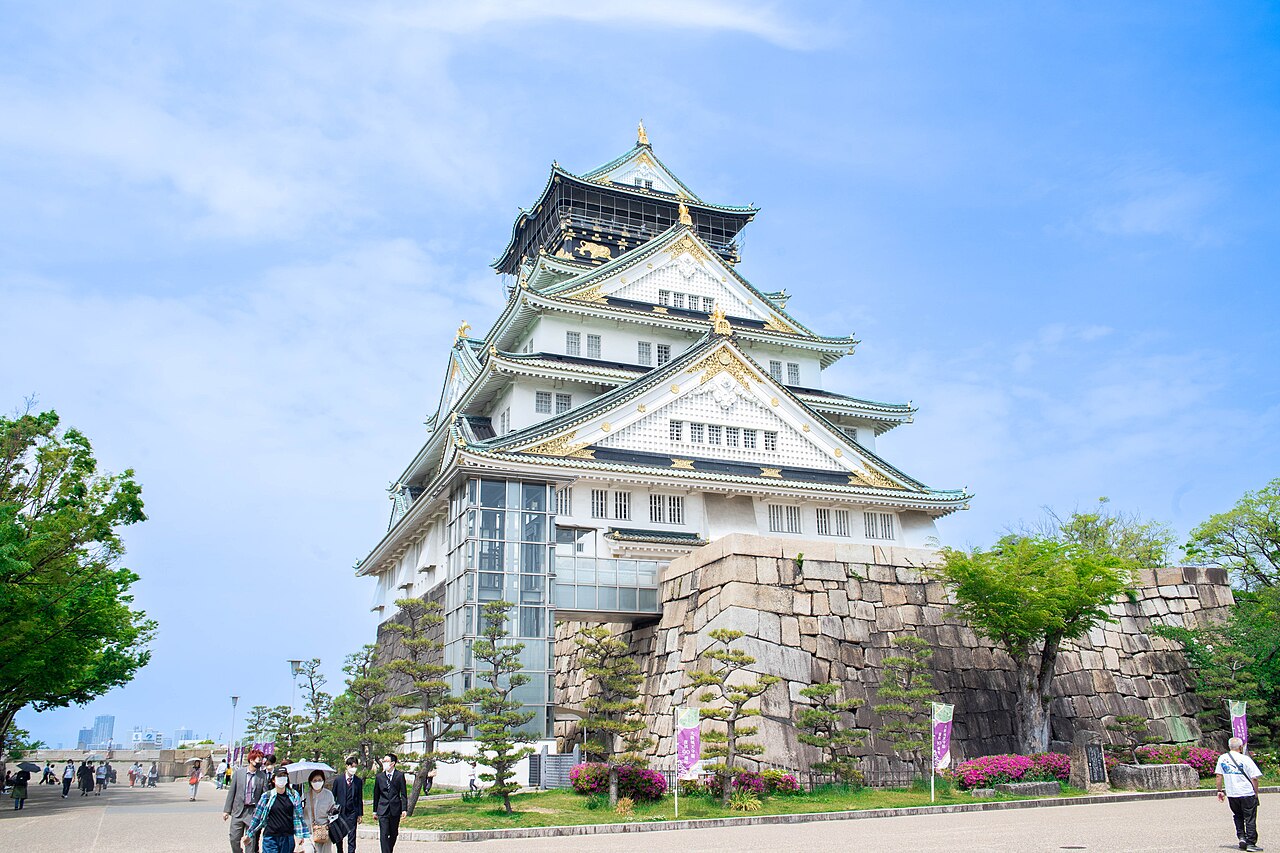 Osaka Castle - The main tower rising above the stone walls in spring